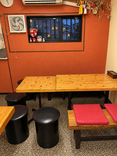 Tables joined for a group of 7–8. Combined with the counter into one big table, it seats 10–15. Private hire is possible